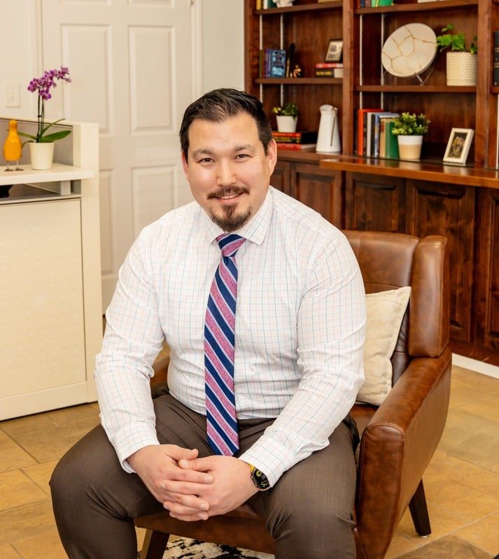 Jonathan Saucier, DNP, PMHNP-C, seated in his North Hills office